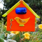 Orange bird house fused glass yard art